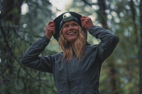 woman in the woods while raining