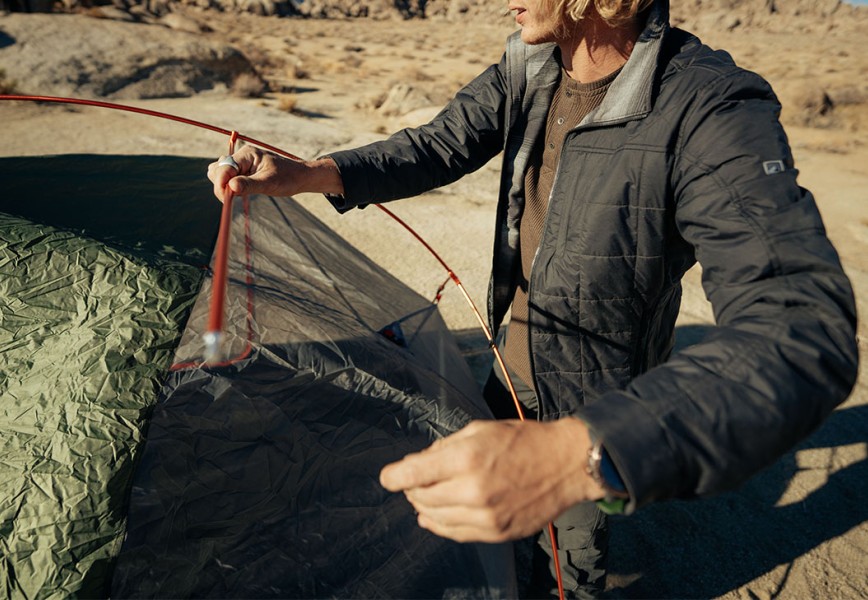 A man making a tent in mens fall jacket