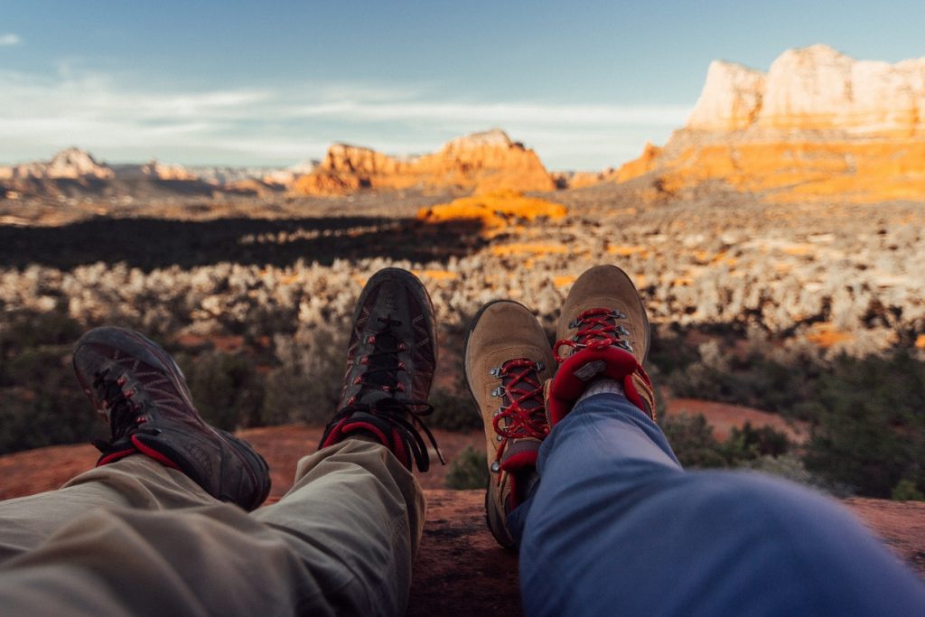 Desert Clothing 3 - Man and woman resting after hiking in the desert..