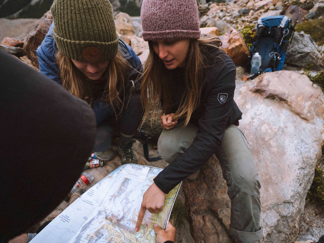 two women looking at the route map