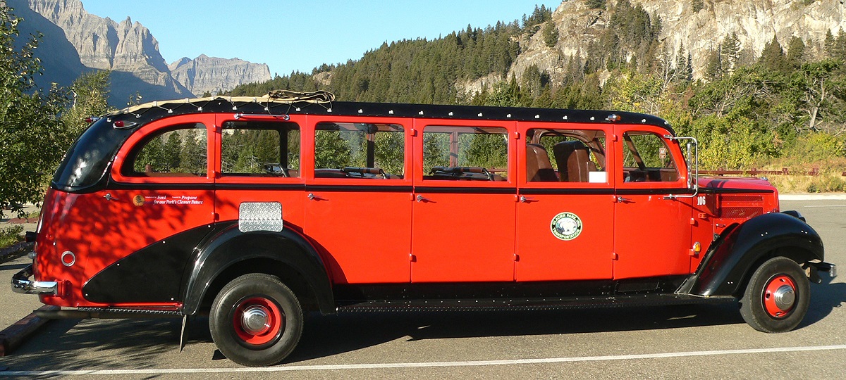 old red bus on mountain road