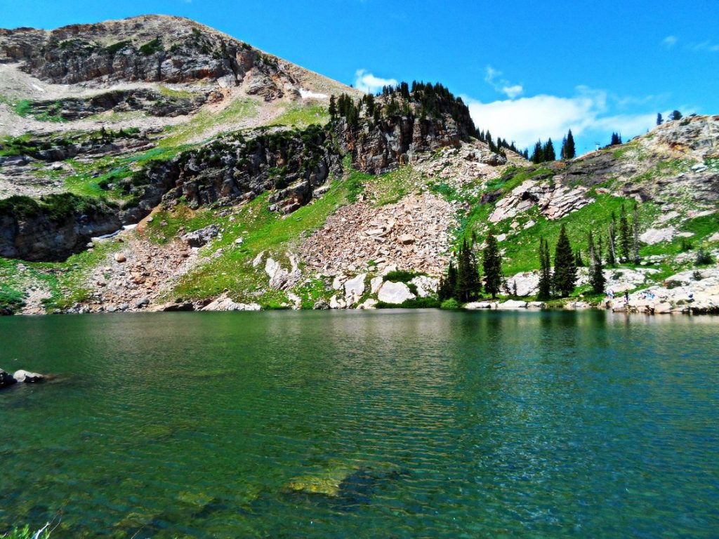 body of water with rocky formations background