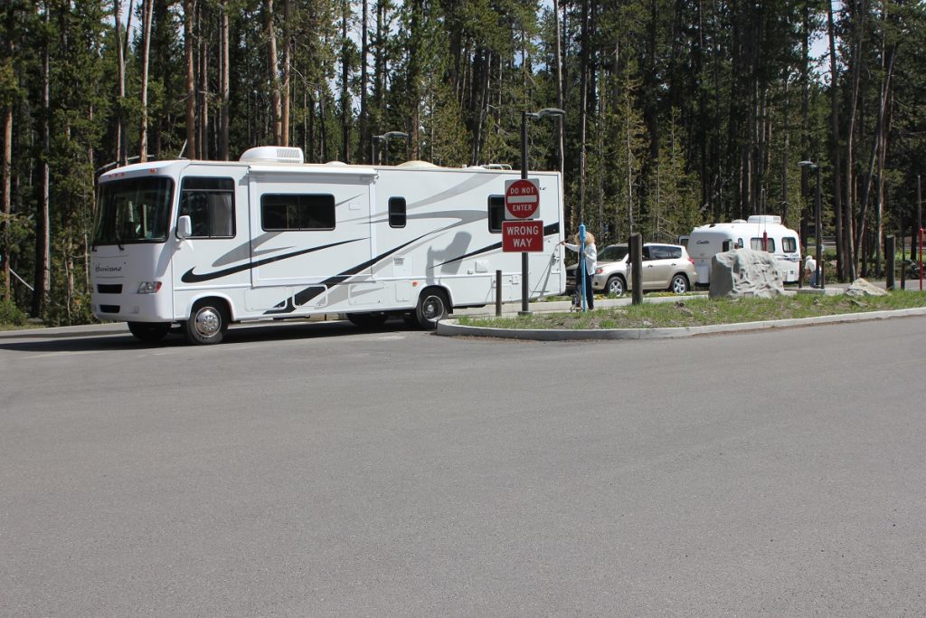 white RV at RV dump station