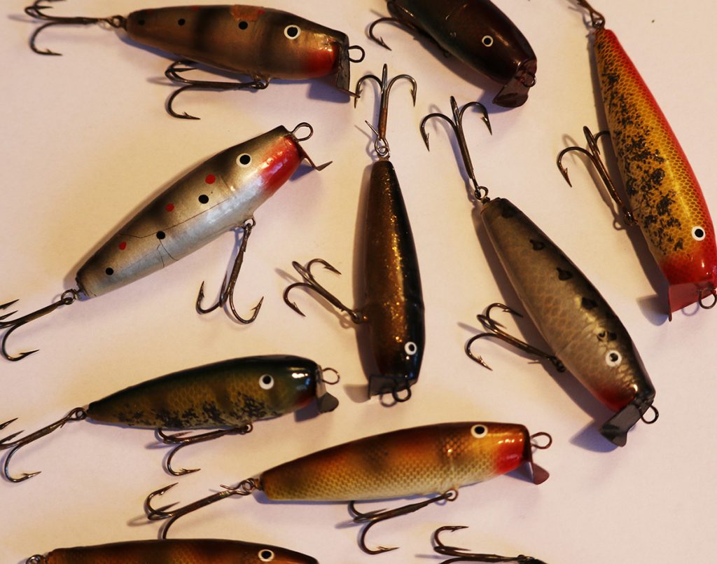 various fishing lures on white background