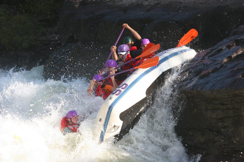 people rafting in whitewater