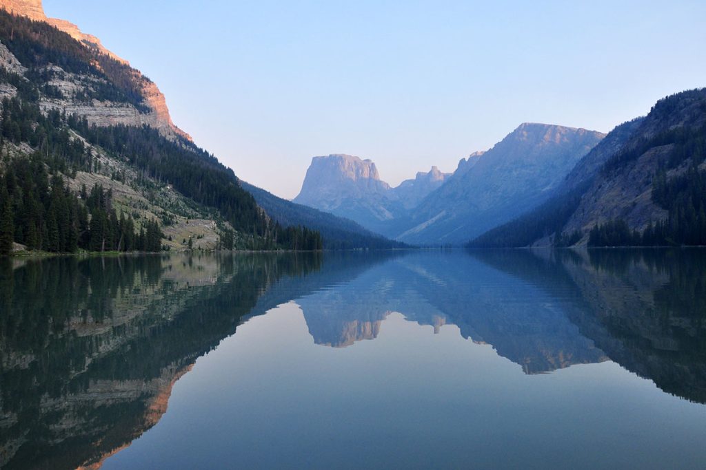 reflection of the mountains on the lake at dawn